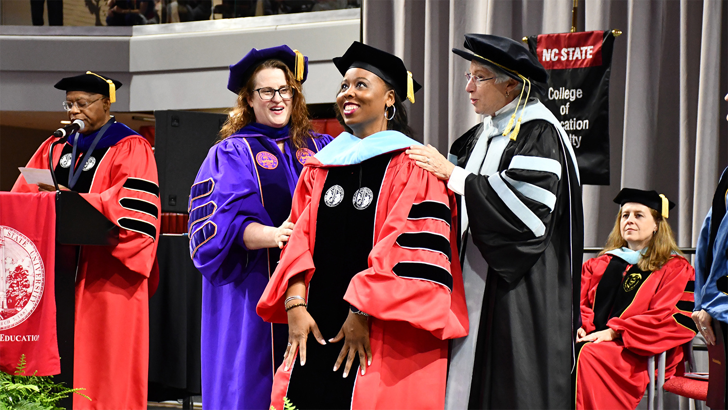 The hooding of a doctoral student during May 2019 Graduation.