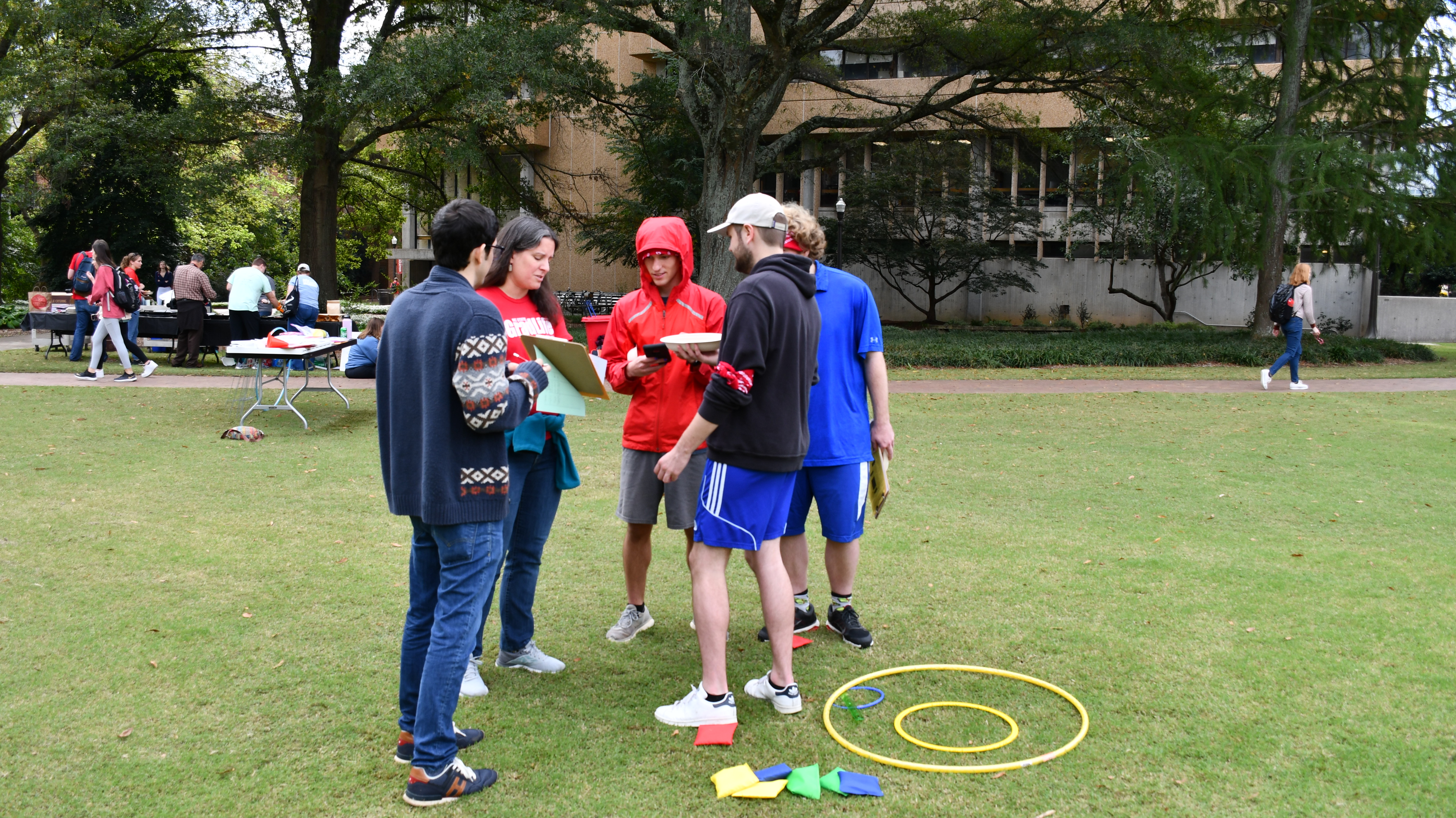 Students check the results of a bean bag toss game at Mathematics Field Day