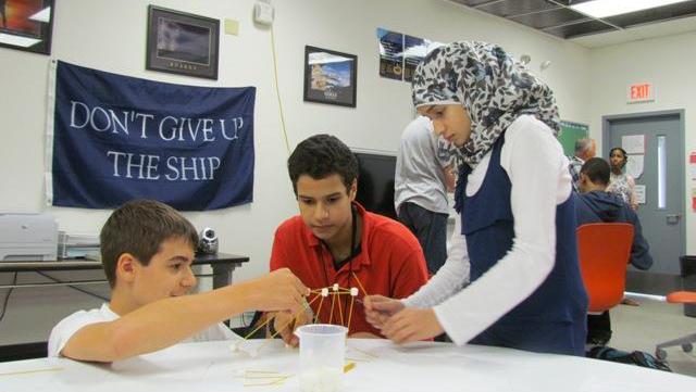 A photo of Wake STEM Early College High School students working together