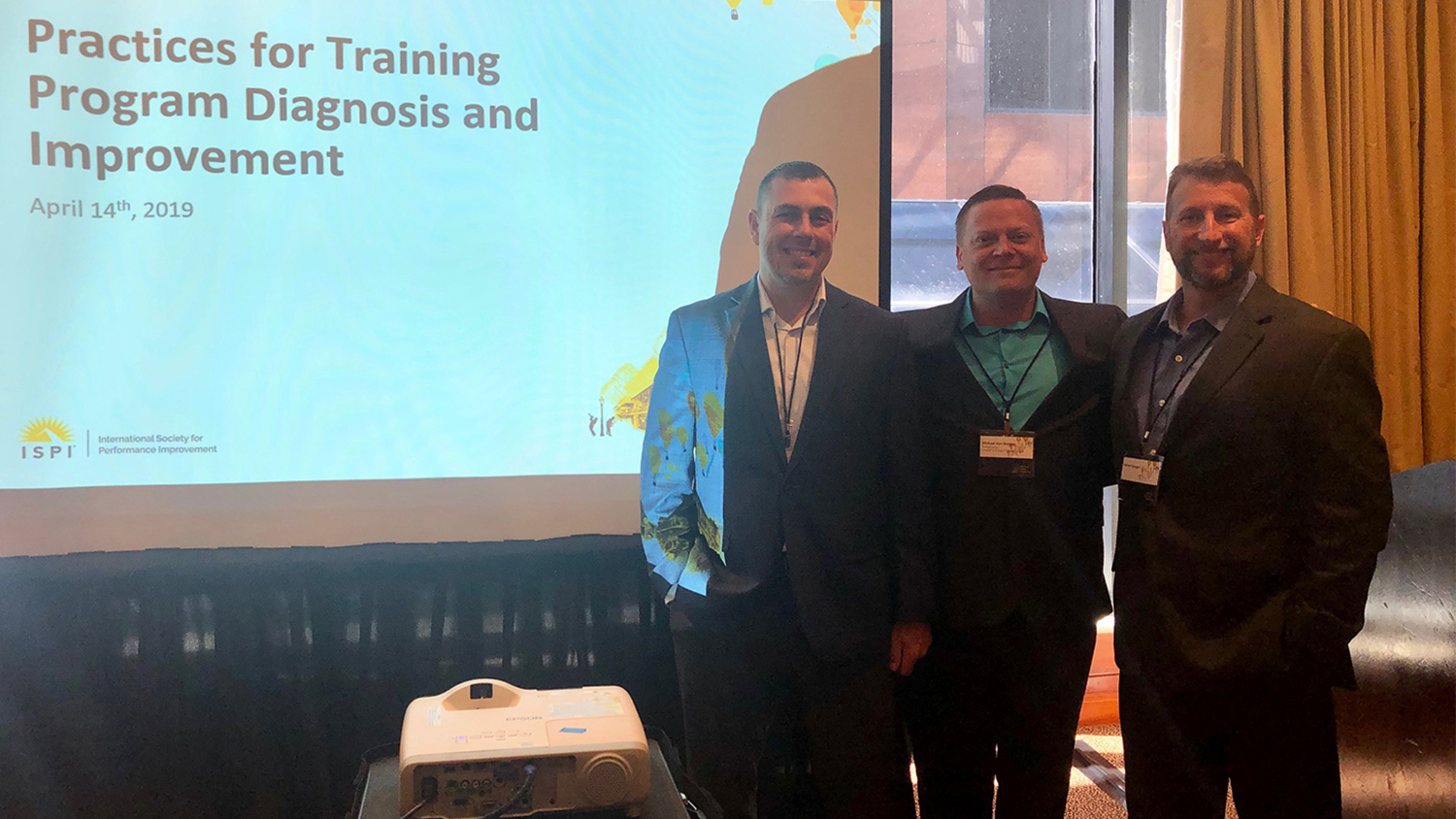 Jason Cook, Michael Von Bargen and Richard Singer at the International Society for Performance Improvement (ISPI) Annual Conference in New Orleans in April 2019. The group is set to graduate from the Master of Education in Training and Development program this May. The three are pictured in front of their presentation screen.