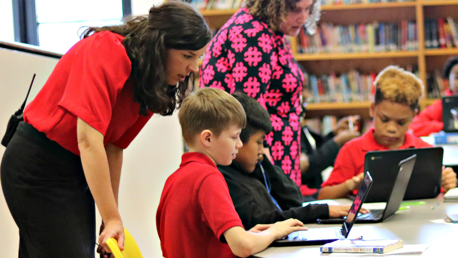 A principal with students at a public school in North Carolina.