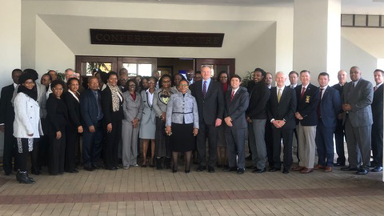 College of Education Associate Professor poses with others in Botswana