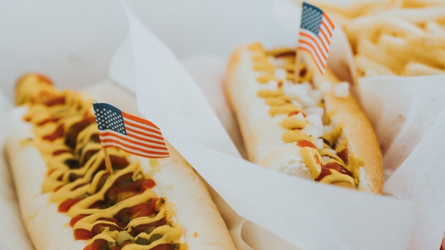Hot dogs with American flag decorations.