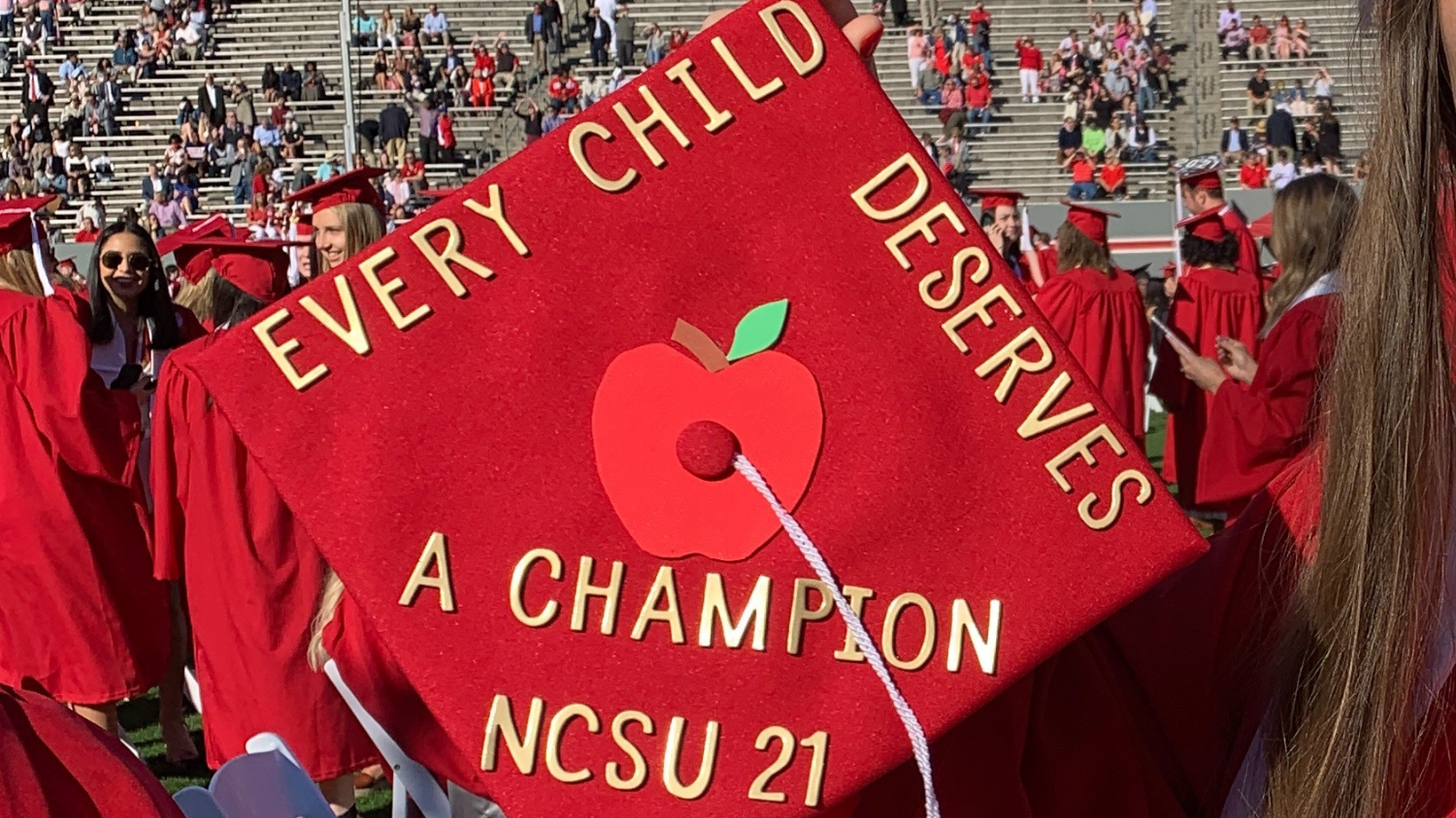 Graduation cap with message that every child deserves a champion