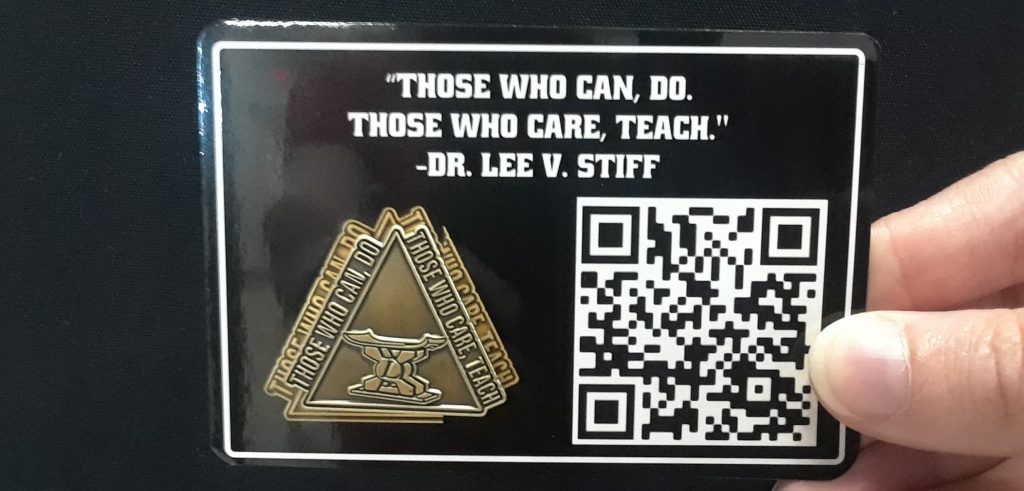 A pin worn by NC State College of Education faculty in honor of Lee V. Stiff, Ph.D. says "those who care, teach."