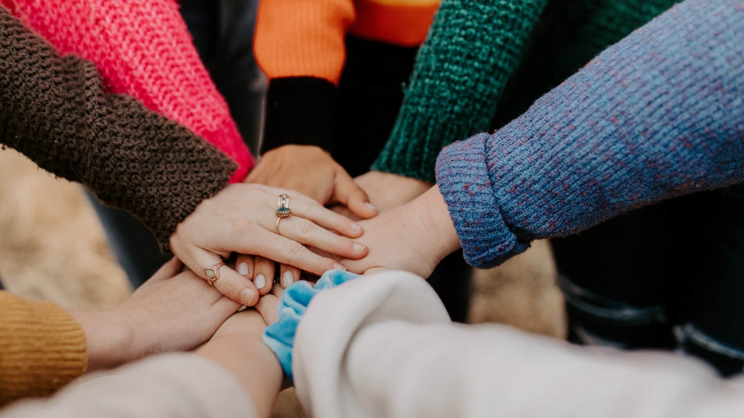 Hands piled together