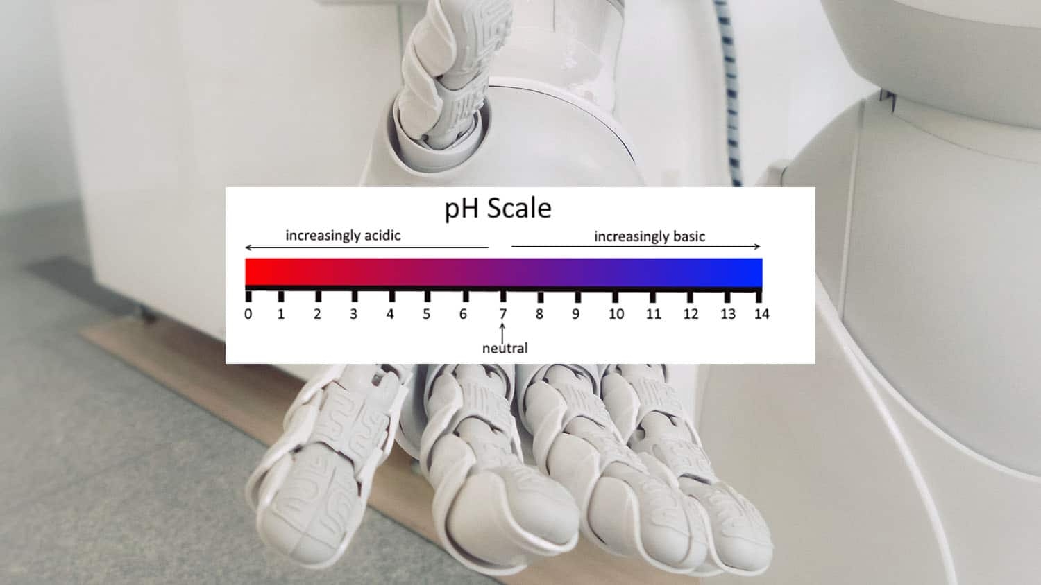 Robotic hand holding a pH color strip.