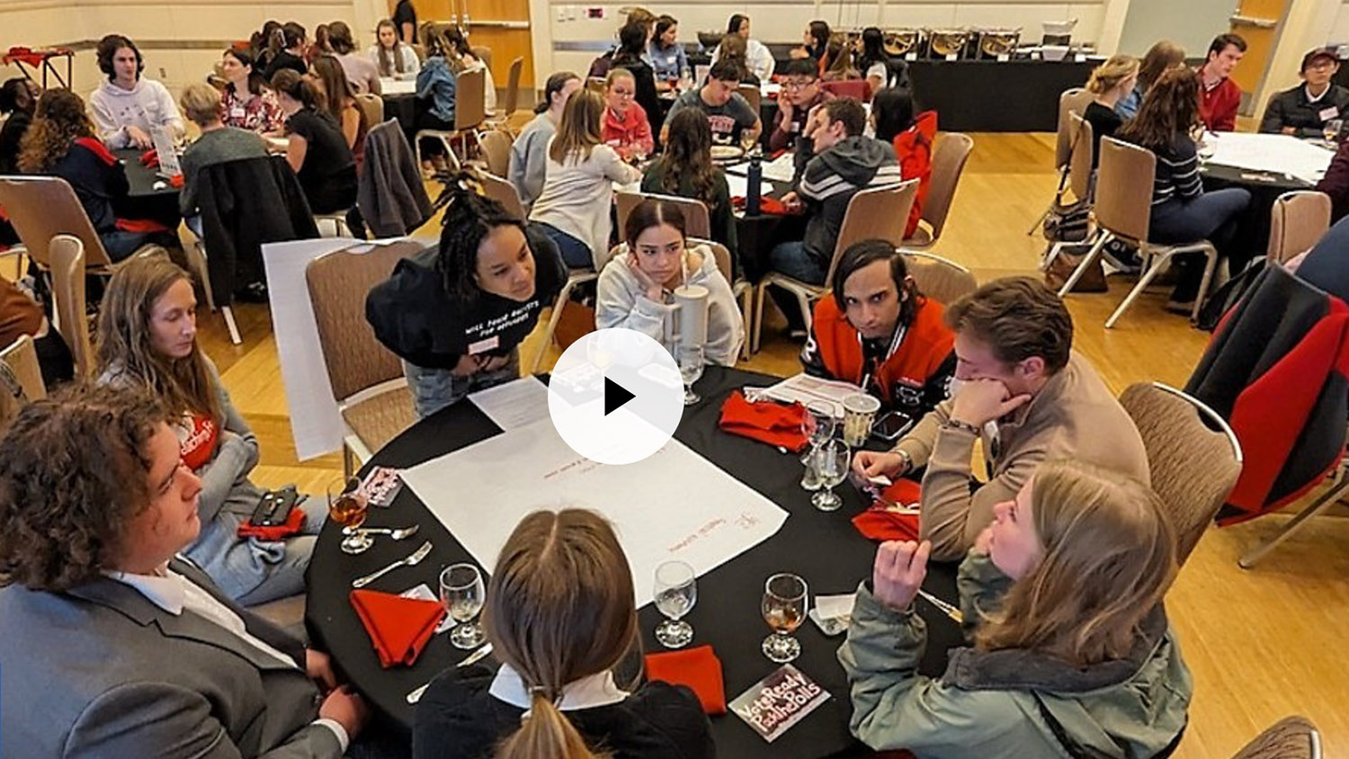 students and staff at table during Dining with Democracy