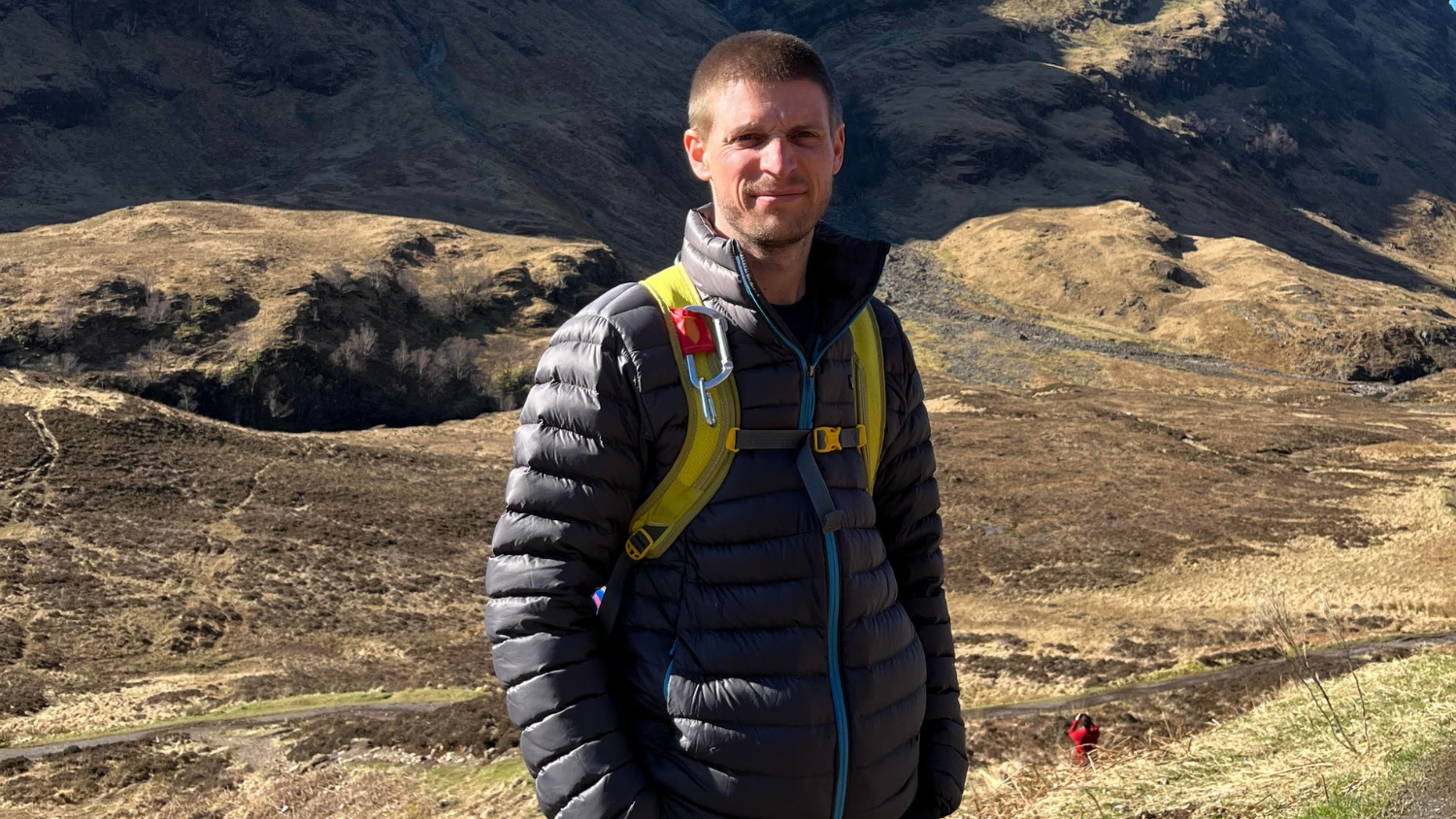 Dale Hammer, wearing a puffy jacket, standing outdoors. 