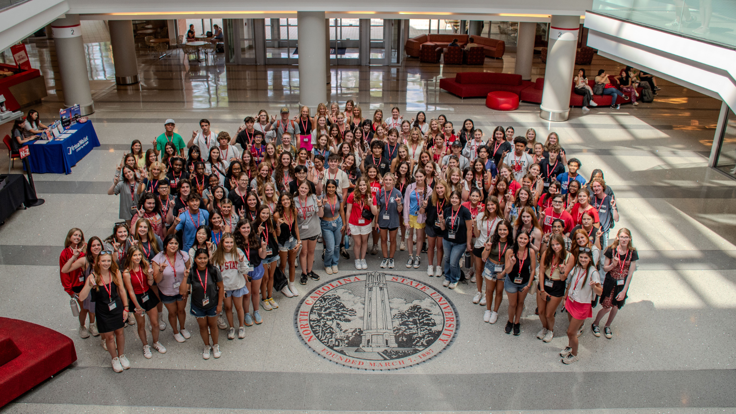 Incoming NC State College of Education students gathered around the seal in Talley Student Union.