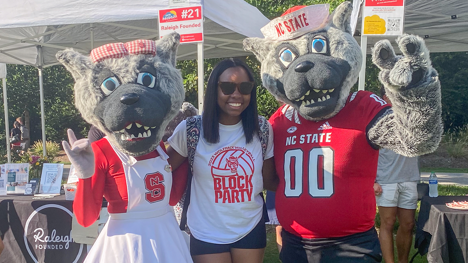 Teaching Fellow and elementary education major Kaiya Connor poses with Mr. and Ms. Wuf