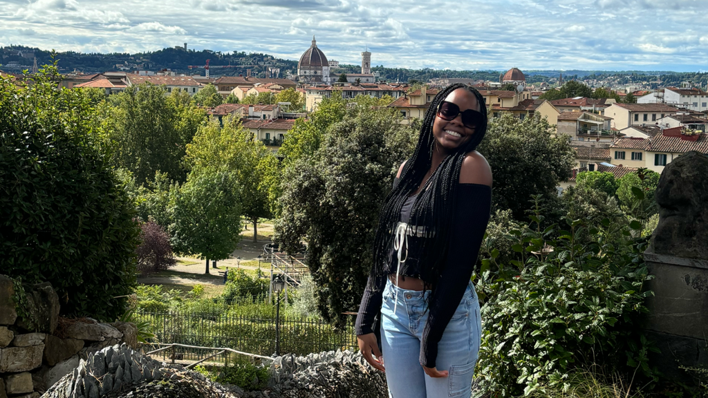 Teaching Fellow and elementary education major Kaiya Connor stands in front of the city of Florence, Italy. 