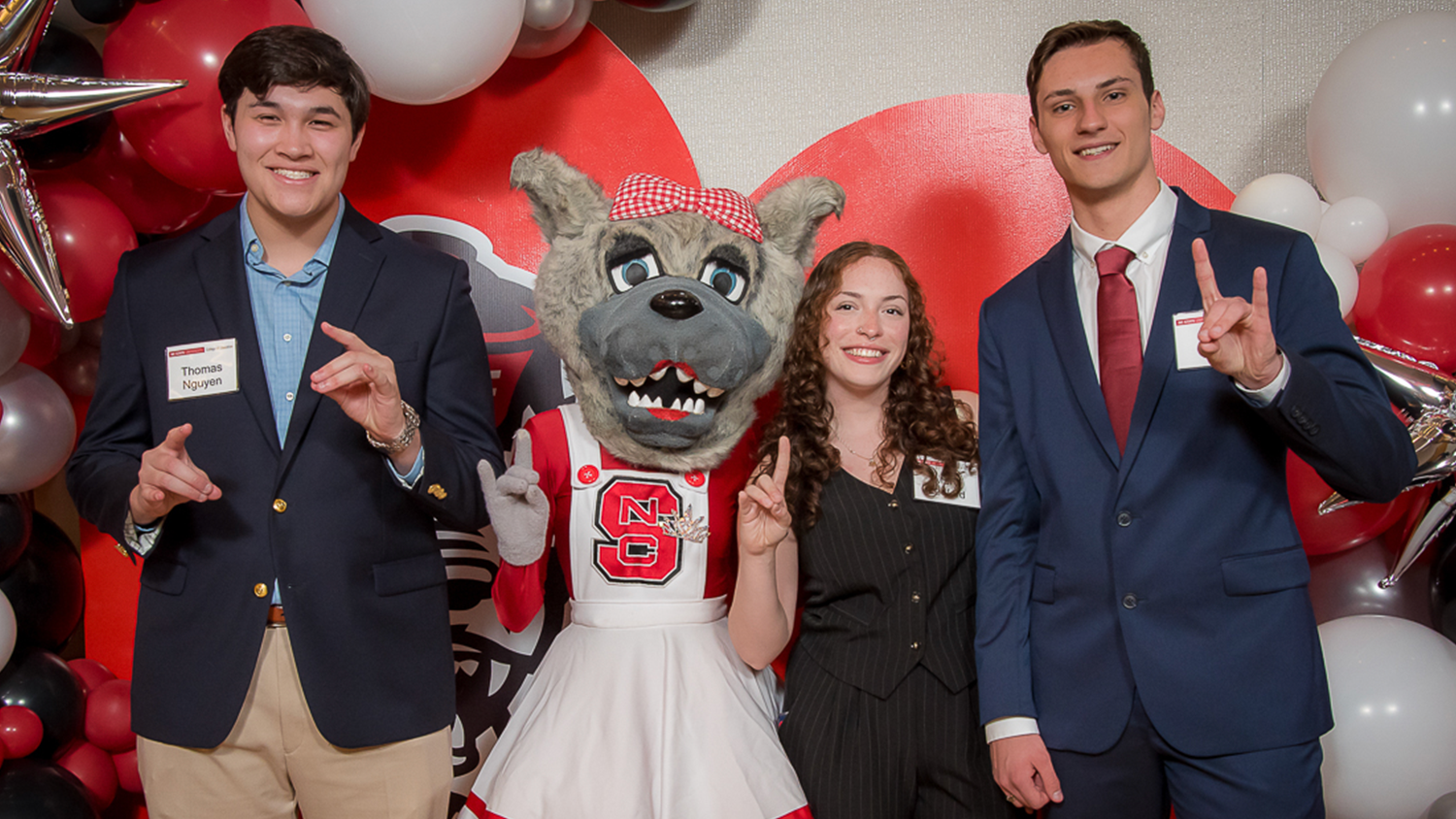 A photo of three College of Education scholarship recipients with Ms. Wuf
