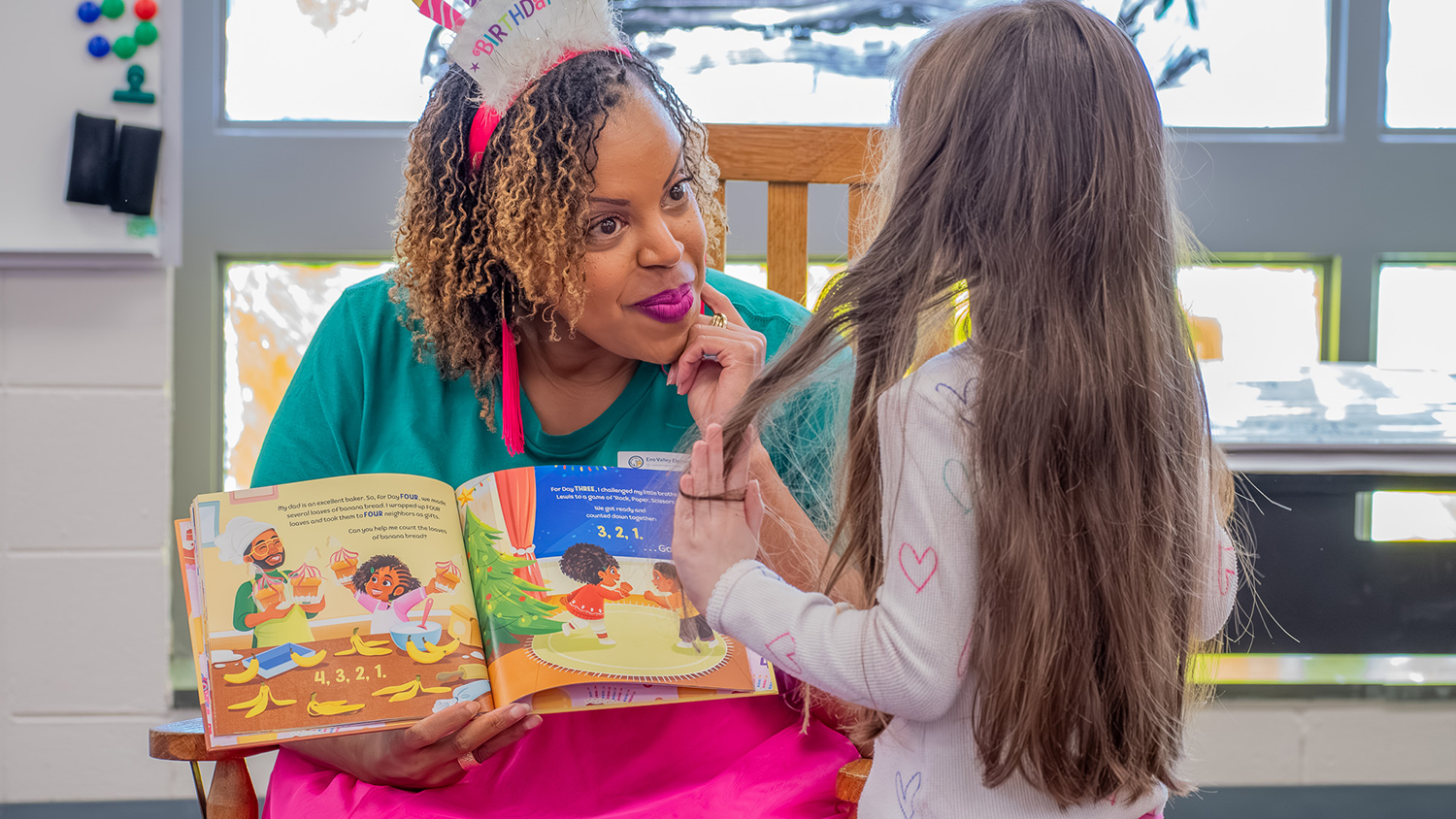 Marielle Myers with a young reader
