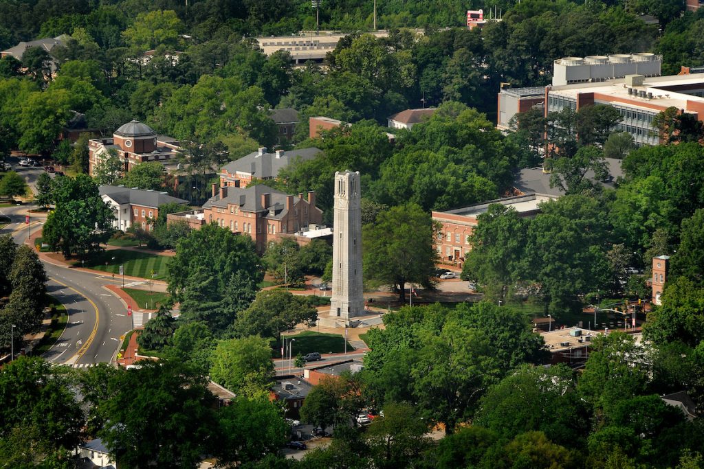 Aerial of Memorial Belltower and surrounding buildings on campus.