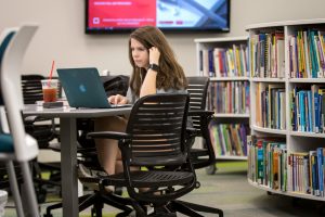 student working in a library