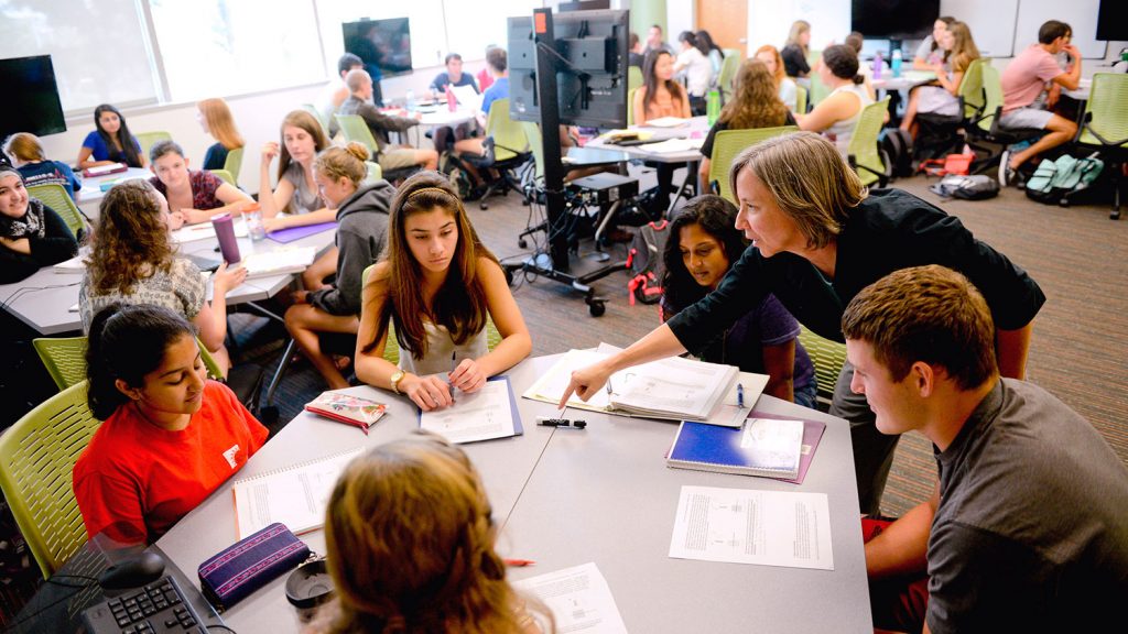 Teacher with students