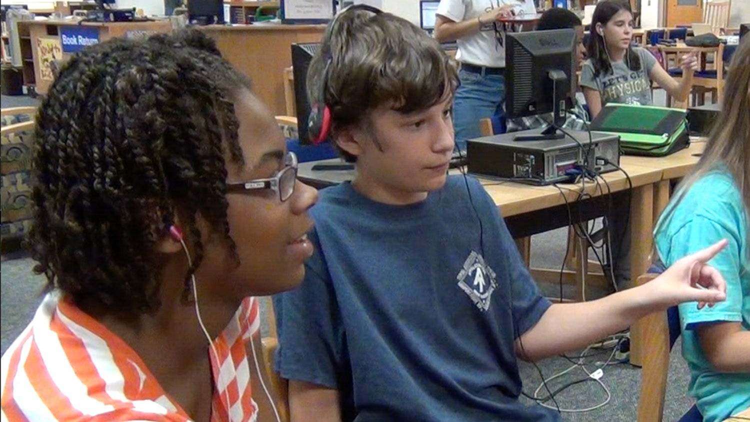 Students at Reedy Creek Middle School interacting with Wiebe's computer game.