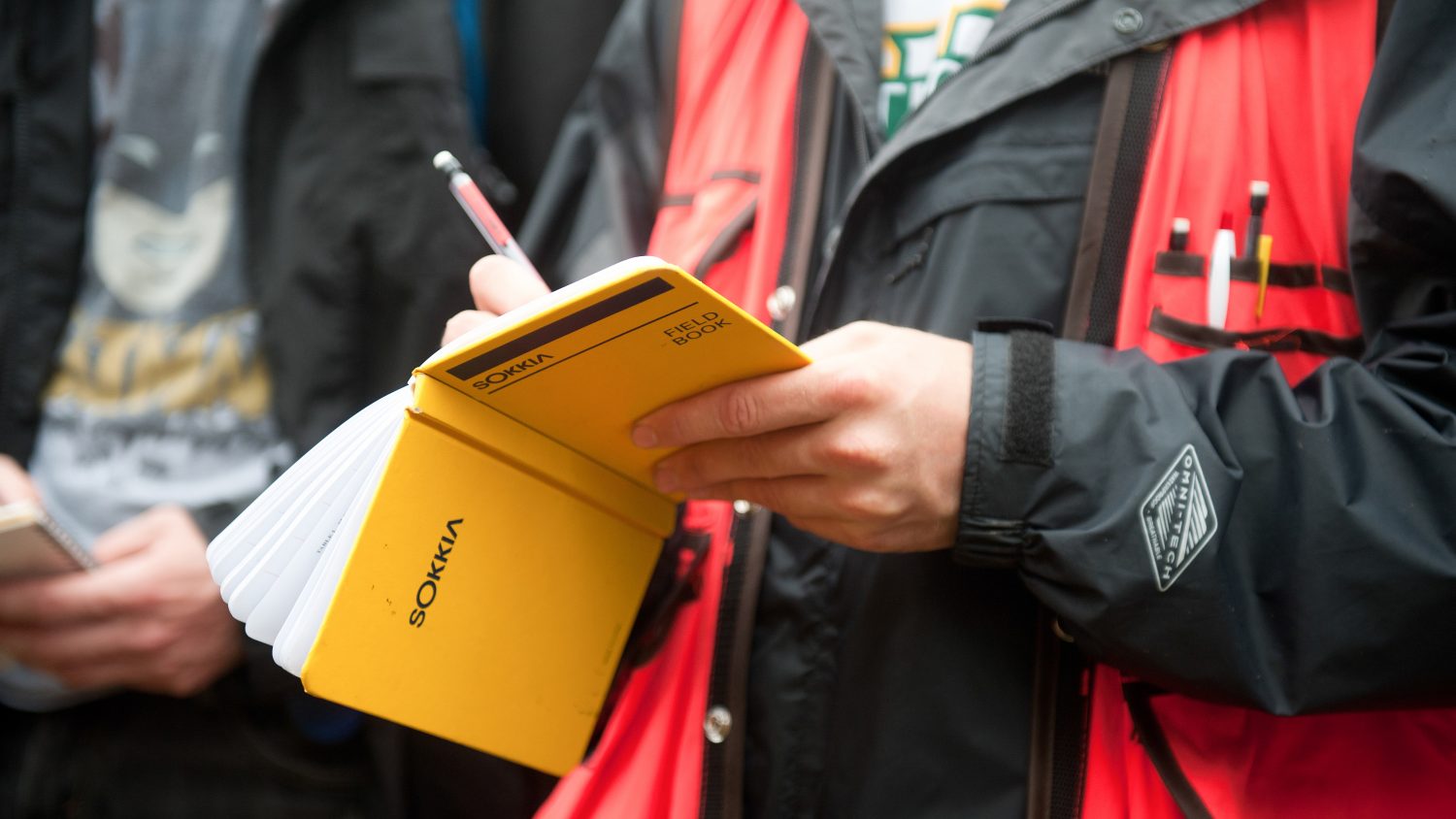 Photo of a citizen taking notes while birdwatching