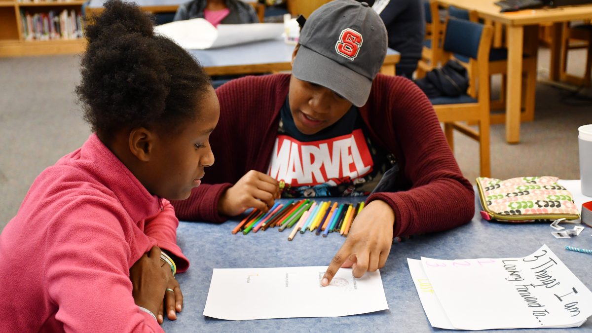 A photo of NC State Education student Sydney Reid during a SAY Village mentoring session