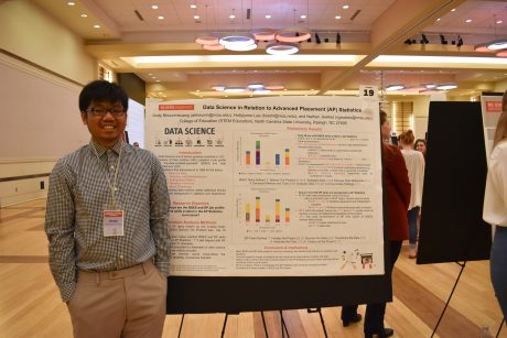 A photo of Andy Khounmeuang at the research symposium