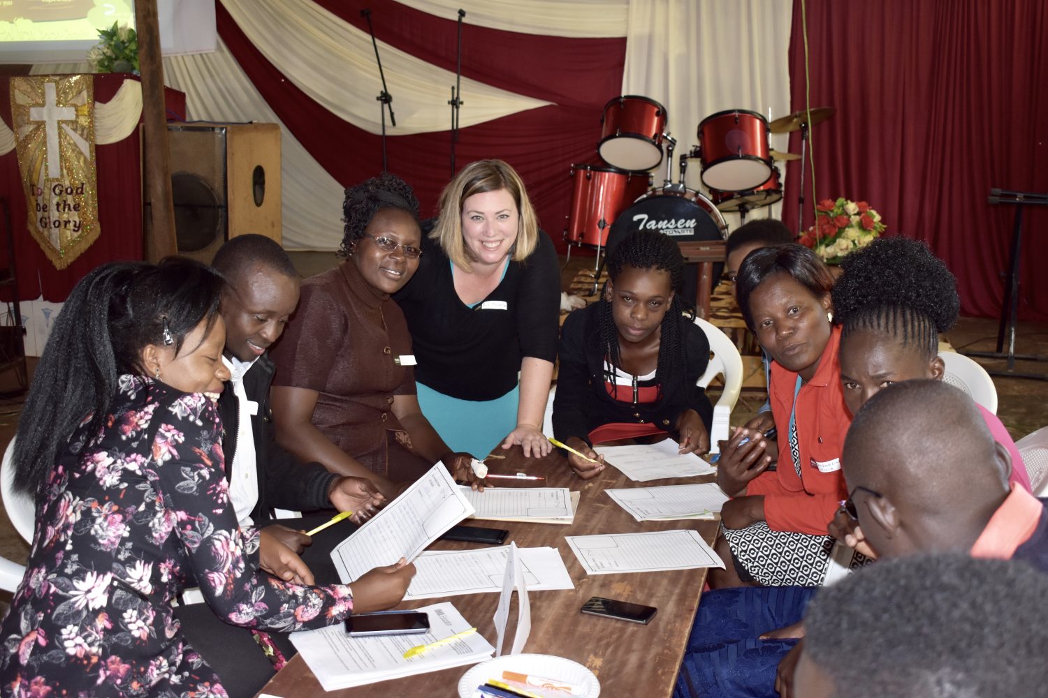 Michelle Falter, Ph.D., surrounded by teachers in Kenya
