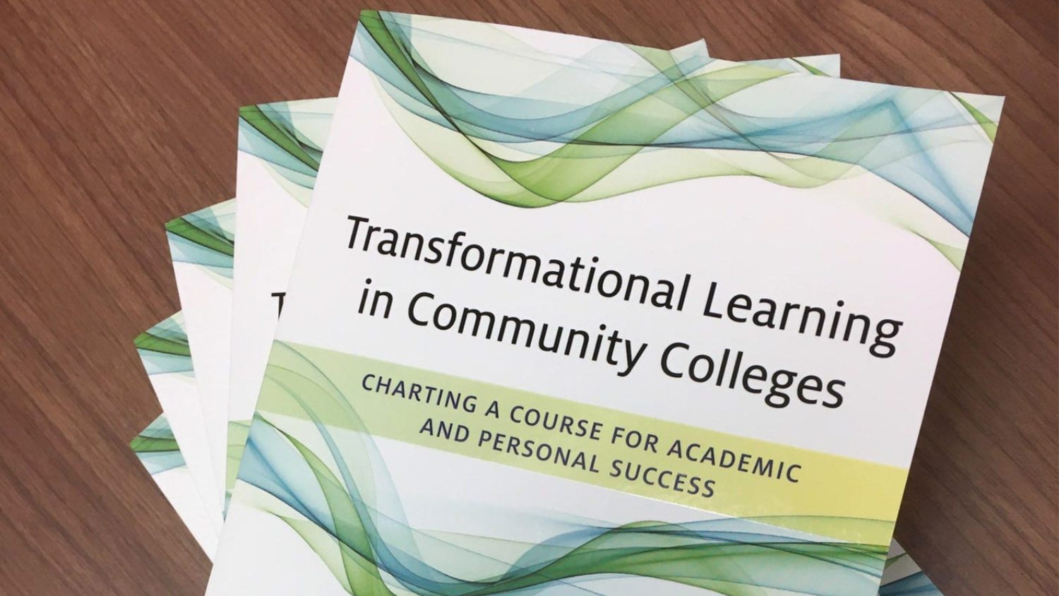 Several copies of Transformational Learning in Community Colleges: Charting a Course for Academic and Personal Success, a new book co-authored by Chad Hoggan, Ed.D.