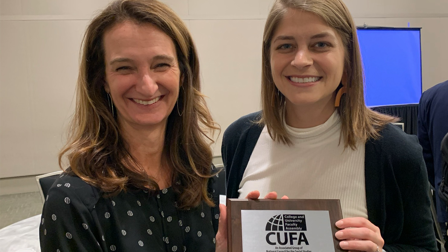 NC State College of Education Associate Professor Meghan Manfra and Doctoral Student Casey Holmes hold their award