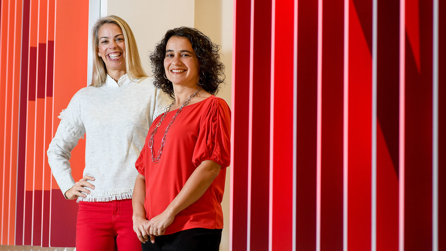 The Friday Institute's Nancy Mangum and Theresa Gibson in the lobby of their building