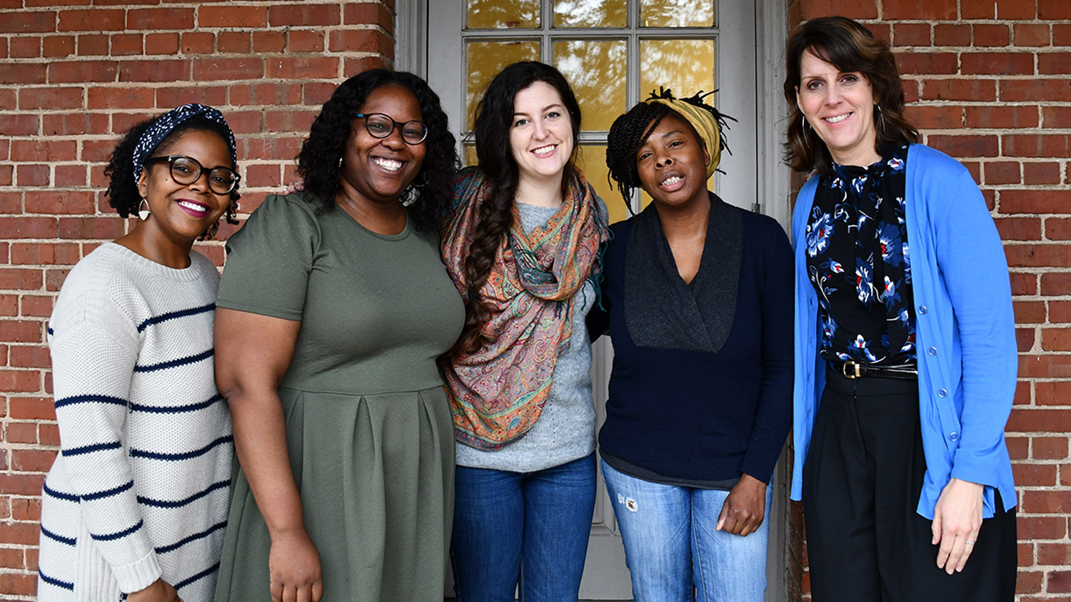 Angela Wiseman stands with Qiana Cryer-Coupet and graduate students