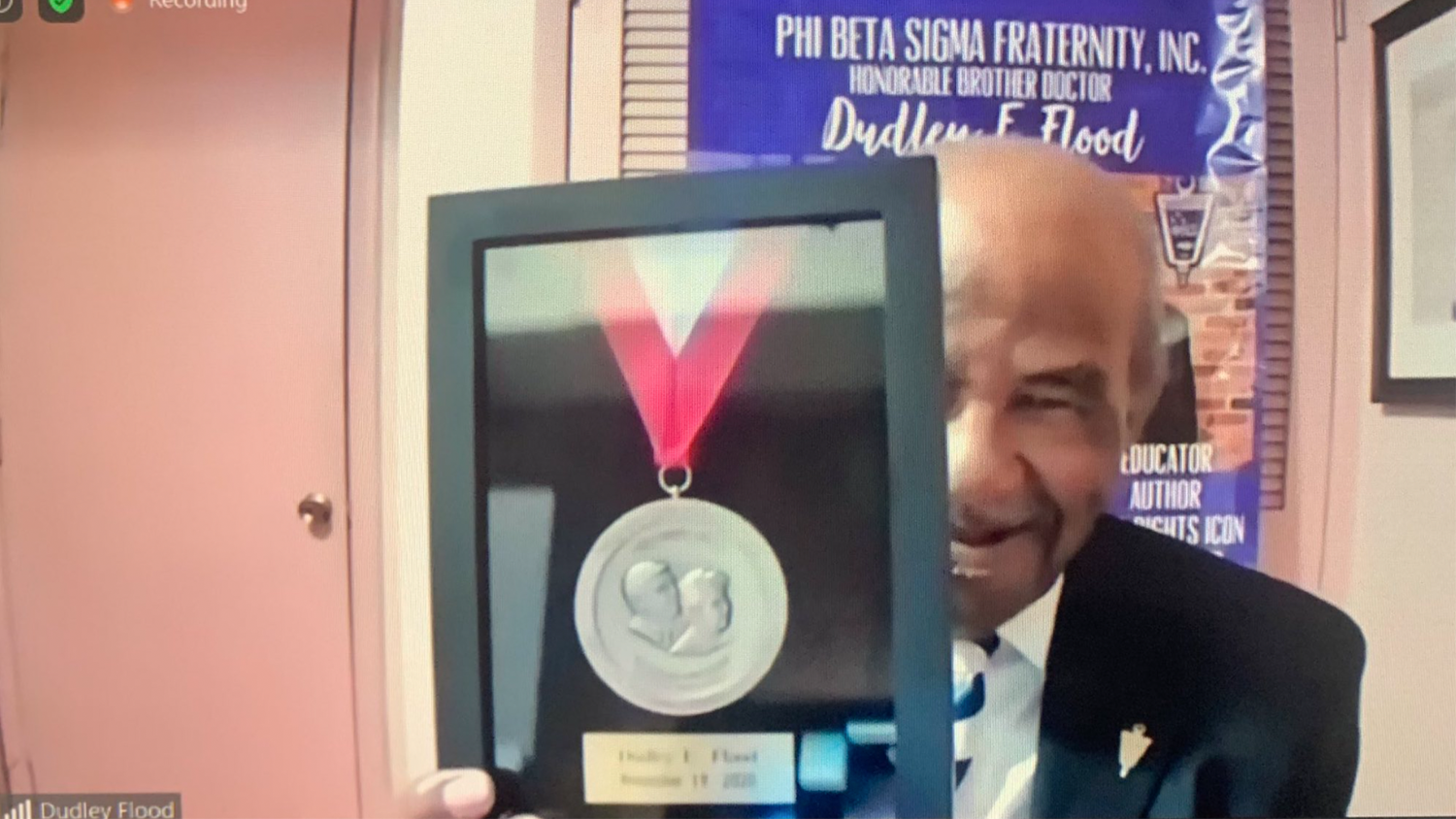 Dudley E. Flood receives the Friday Medal from the Friday Institute for Educational Innovation