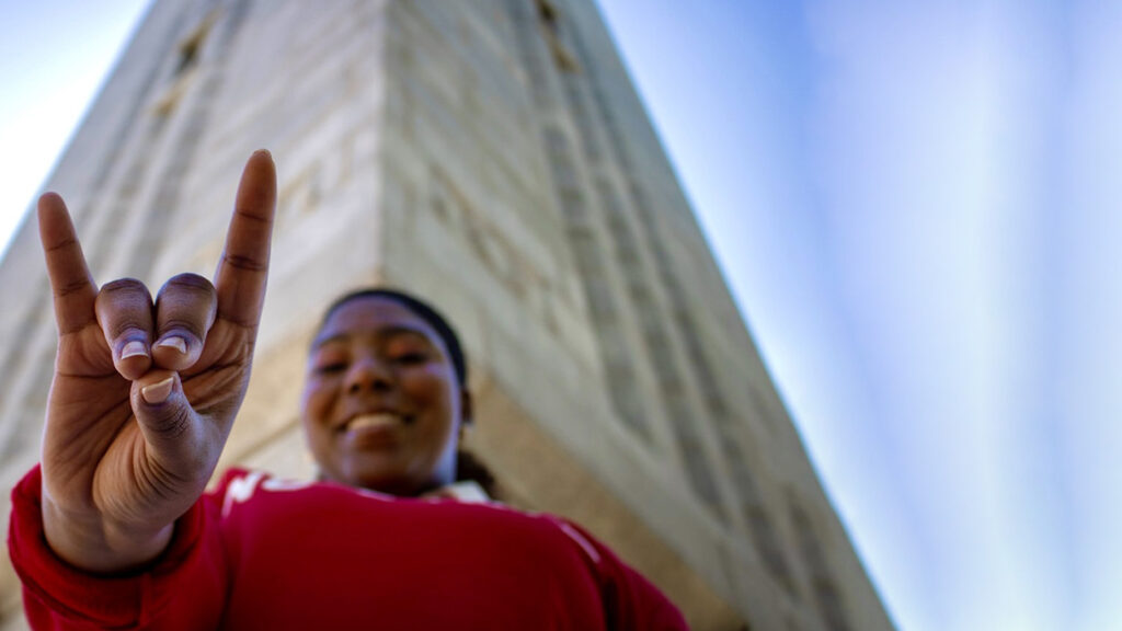 London Tolson holding up wolfies with expanded Belltower