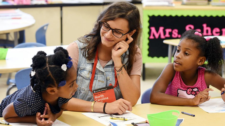TELS professor working with students