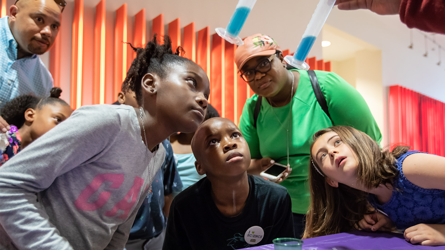 A group of children conduct a science experiment
