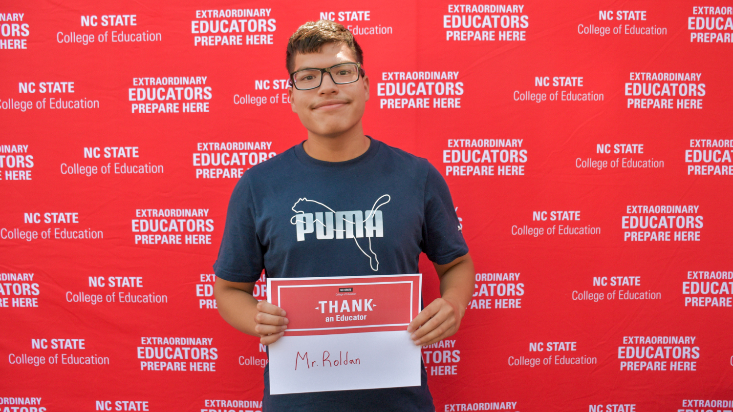 A student and future teacher with a Thank an Educator card
